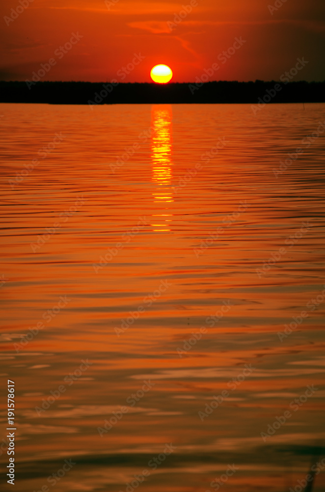 orange sunset over water and sun track background image