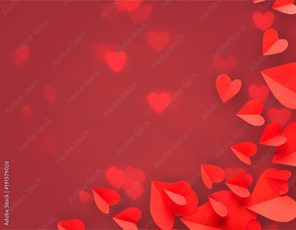 Red paper hearts on background