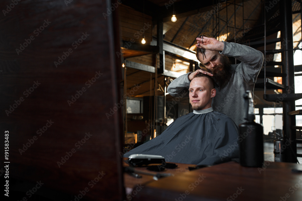 Barber cutting hair of customer Barber cutting hair of customer