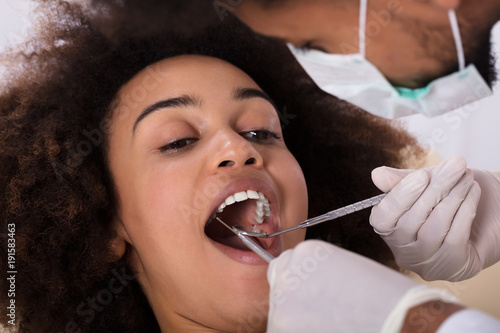 Woman Undergoing Dental Treatment