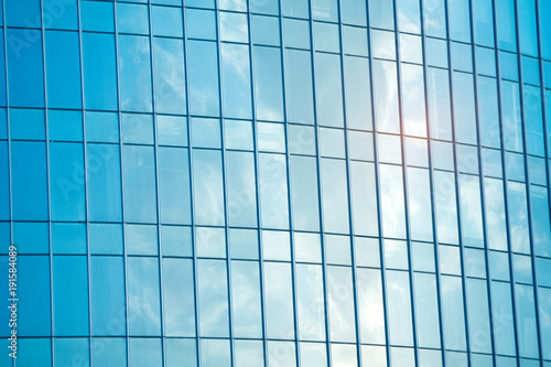 Modern glass silhouettes on modern building.