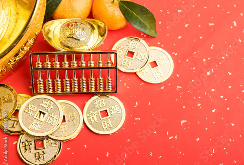 Chinese new year ornament--gold ingot,firecrackers,orange,golden coin and golden abacus,Chinese calligraphy Translation:good bless for new year photo