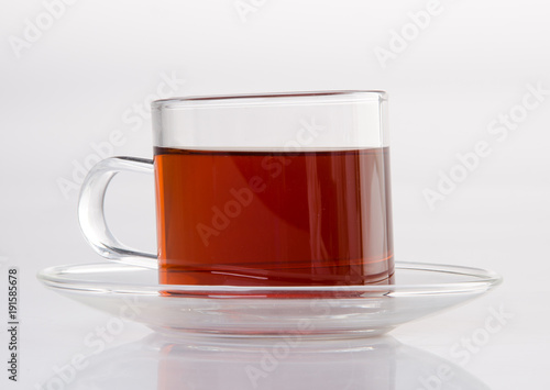 Tea in glass cup on a background. Tea in glass cup on a background