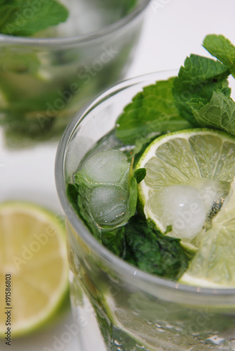 Summer Cocktail Mohito Mint and Lime Refreshing Drink Mojito with Rum and Ice in Glass Isolated. photo