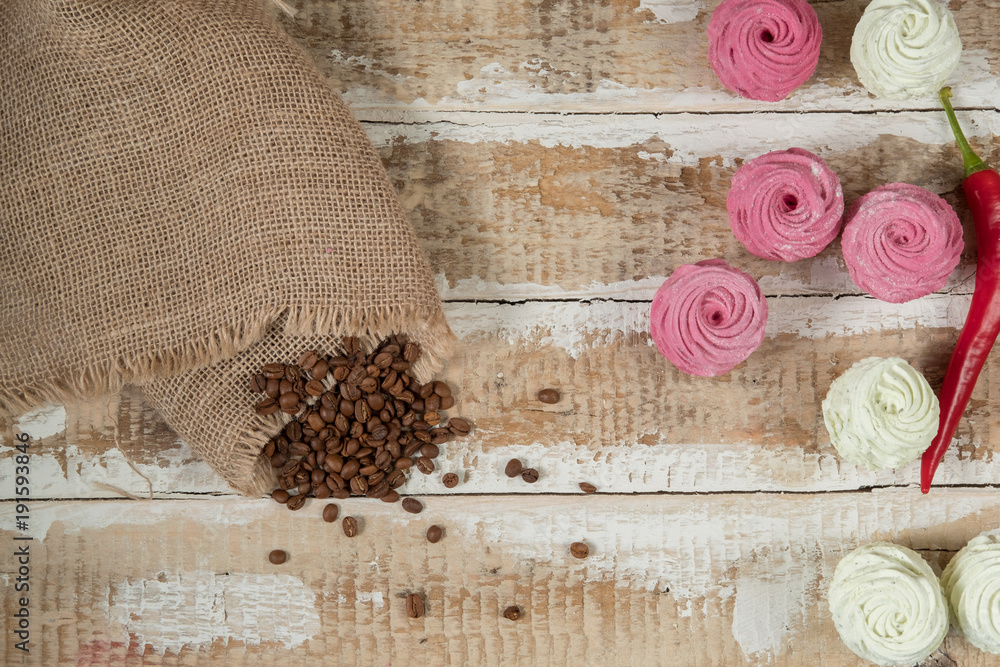 homemade marshmallow cakes made from natural ingredients in a linen napkin on a wooden surface with crumbled coffee beans and hot pepper homemade marshmallow cakes made from natural ingredients in a linen napkin on a wooden surface with crumbled coffee beans and hot pepper
