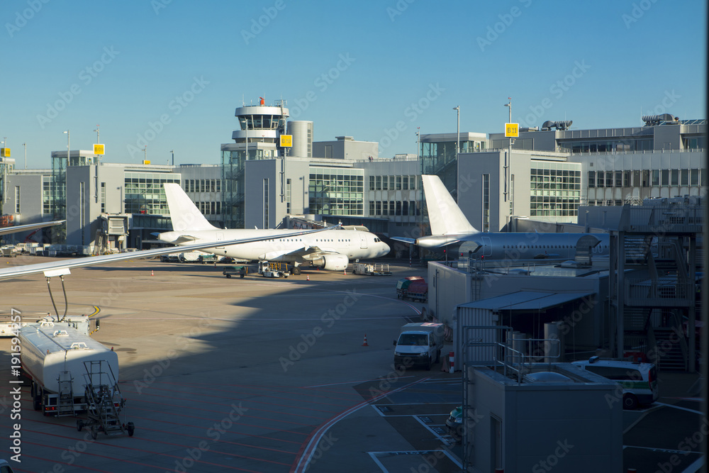 Holiday abroad, more than one aircraft on the apron, there are a number of construction vehicles,