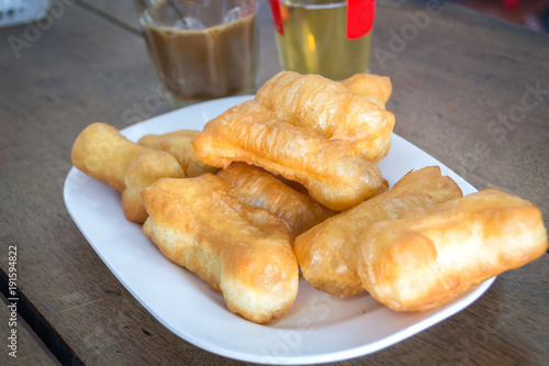 chinese deep fried dough sticks on white plate select focus