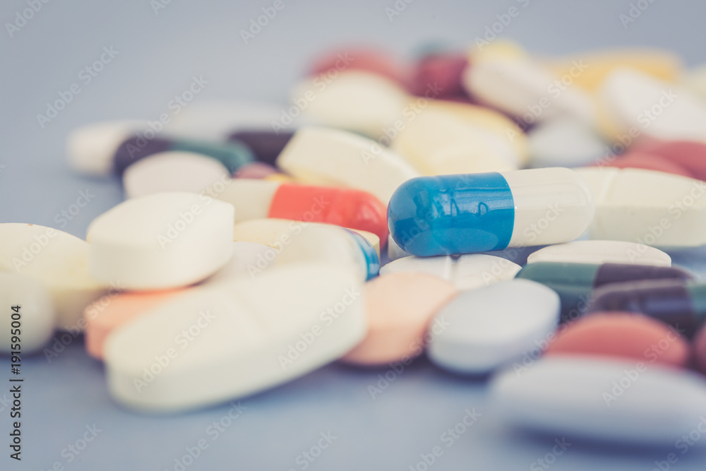 MANY COLORFUL MEDICINE PILLS CONCEPT MANY COLORFUL MEDICINE PILLS CONCEPT