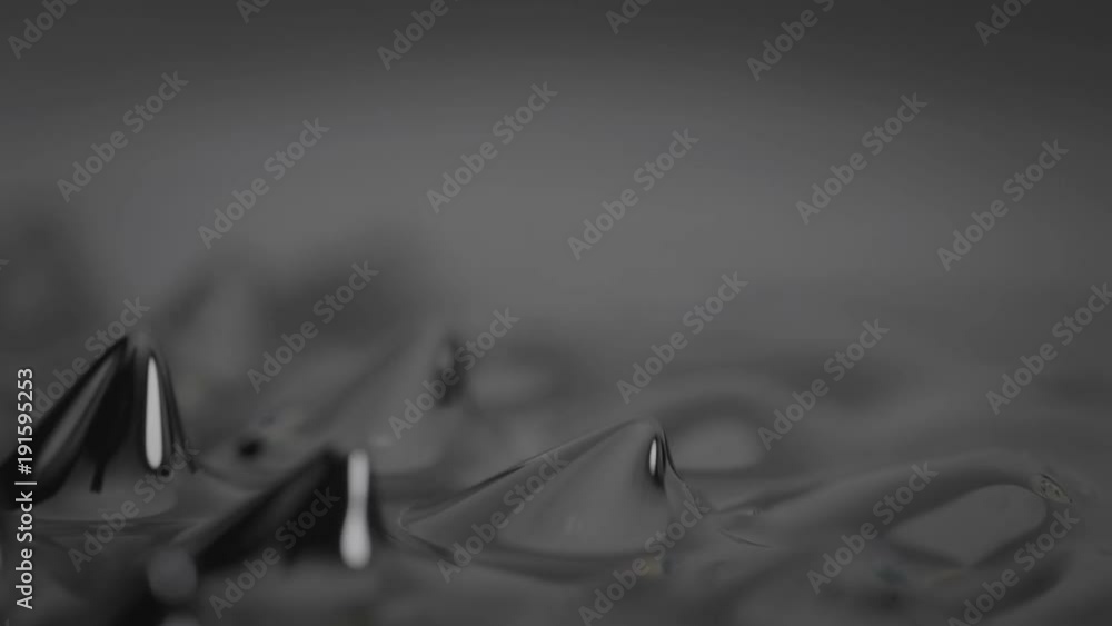 Ferrofluid under the influence of a magnetic field. Сlose-up.
Ferrofluid under the influence of a magnetic field. Сlose-up.