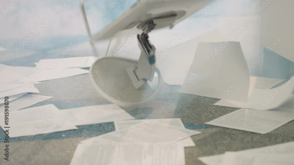 Something smoking in modern office. Documents throwing on floor