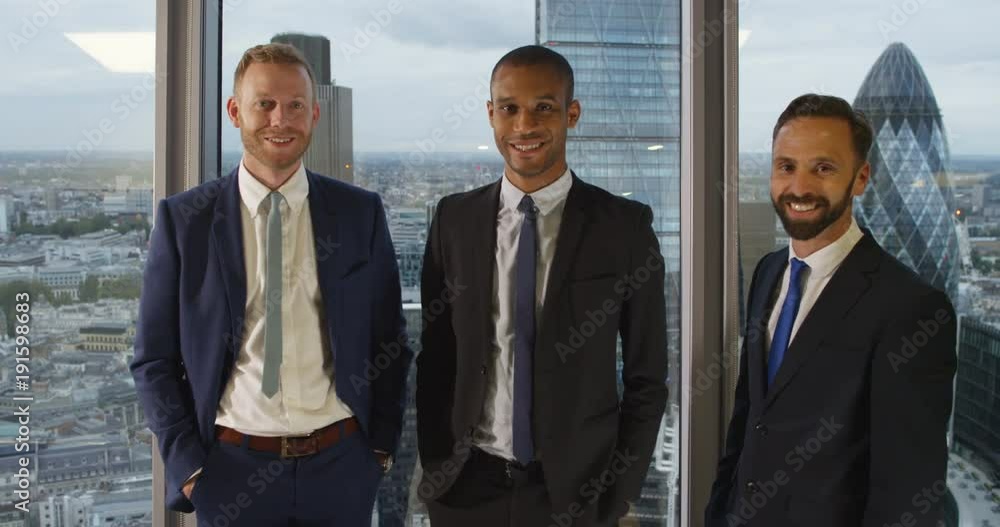 4K Portrait smiling male business team in London city office with panoramic view 4K Portrait smiling male business team in London city office with panoramic view