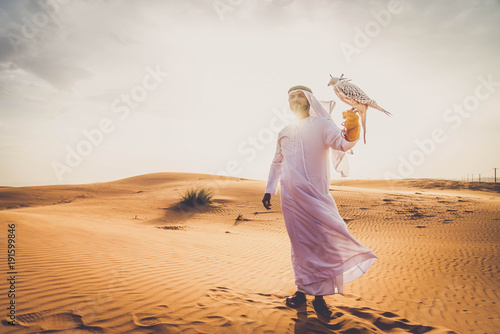 Arabic man in the desert with his hawk