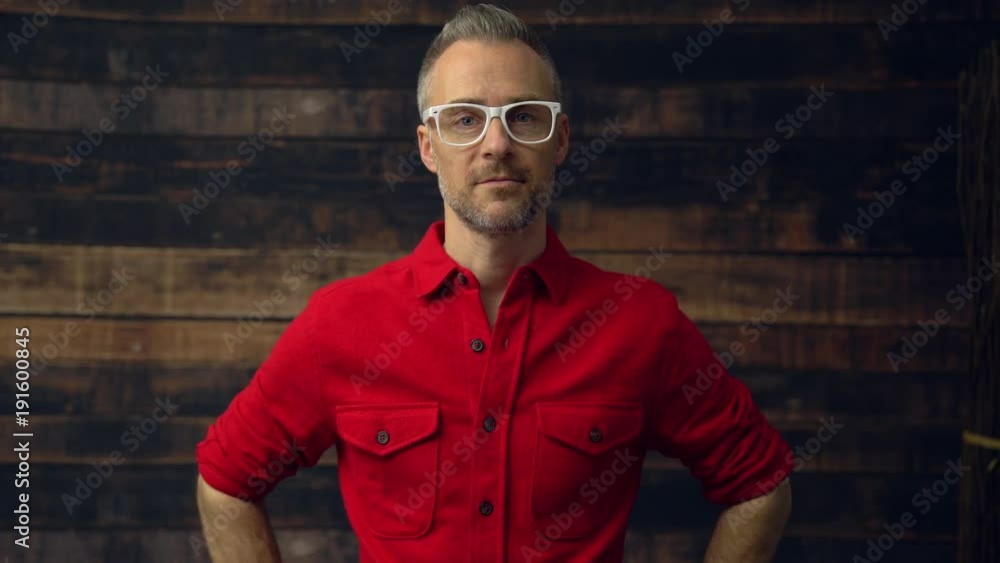 Fashionable hipster walks up to camera Fashionable hipster walks up to camera
