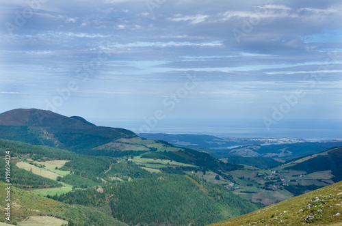 Mountain landscape with views of the sea in the background. © castellanos80