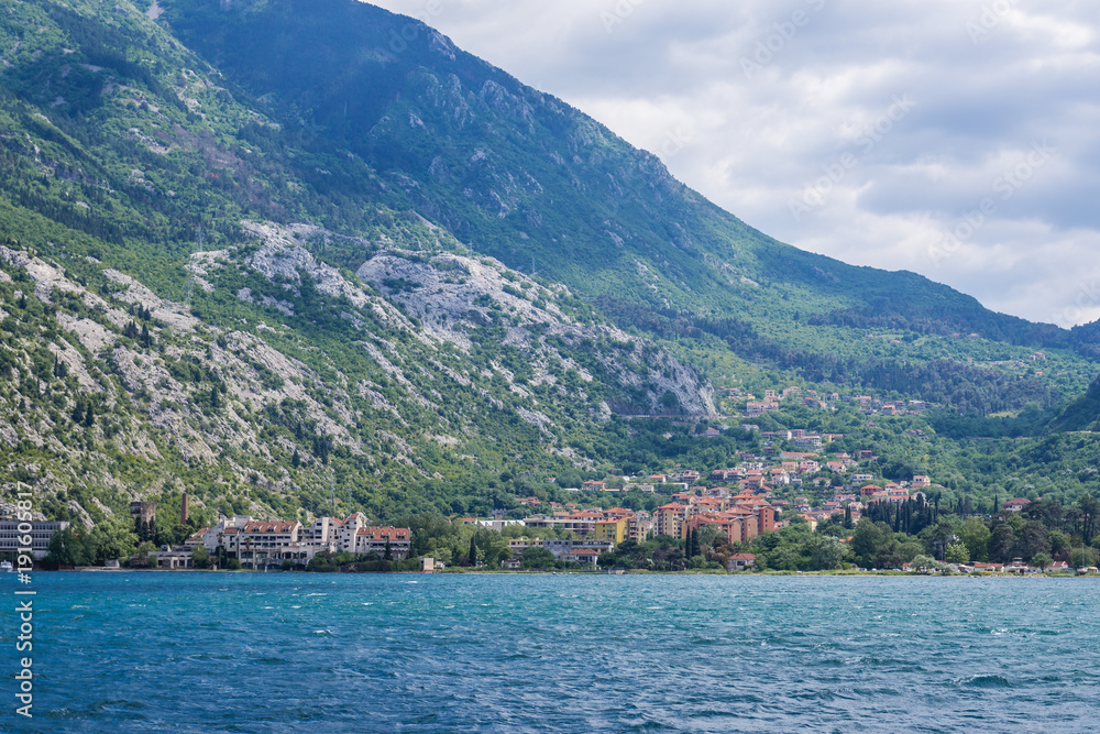 Mountains on the coast of Kotor Bay in Montenegro, view with Skaljari town