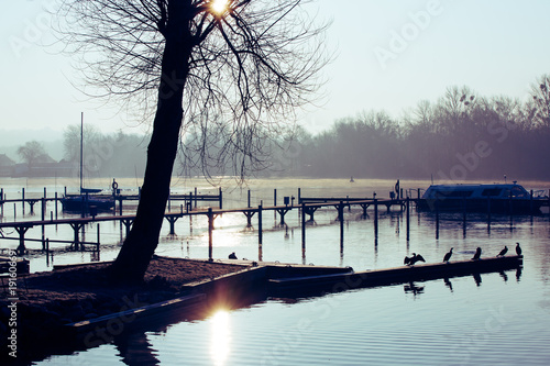 Obraz na plátne Sunrise in the winter over a landing place