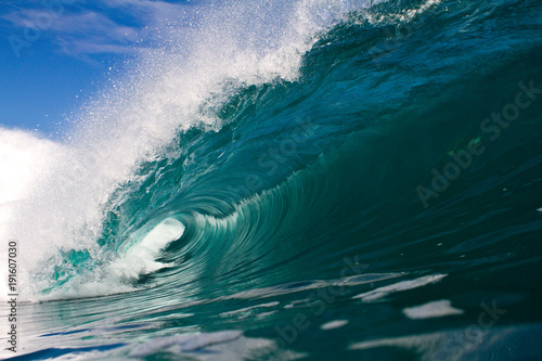 Fototapeta Naklejka Na Ścianę i Meble -  Beautiful perfect wave crashing on a shallow coral reef in indonesia