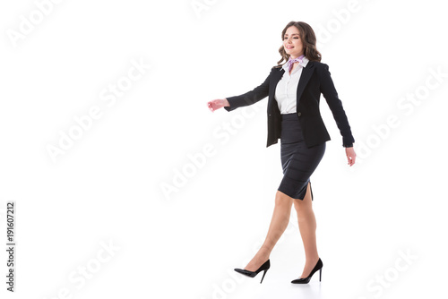attractive stewardess walking isolated on white