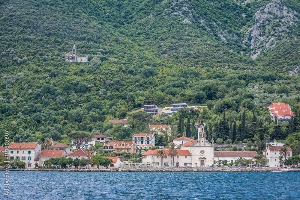 Prcanj, small coastal village in the Kotor Bay, Montenegro, view with St Nicholas church