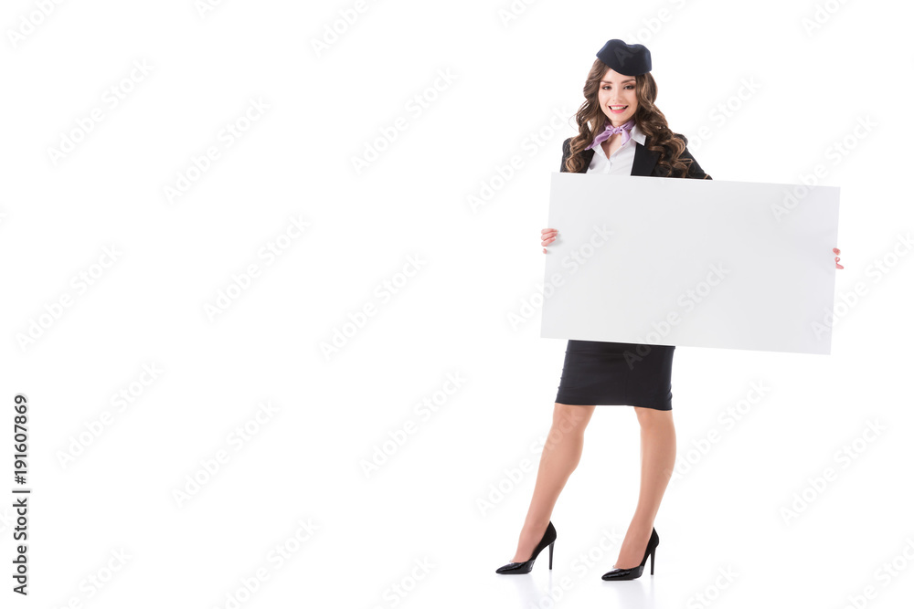 attractive smiling stewardess with empty board isolated on white attractive smiling stewardess with empty board isolated on white
