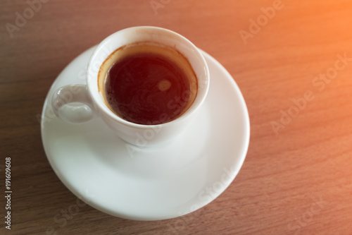 Small white cup with espresso.