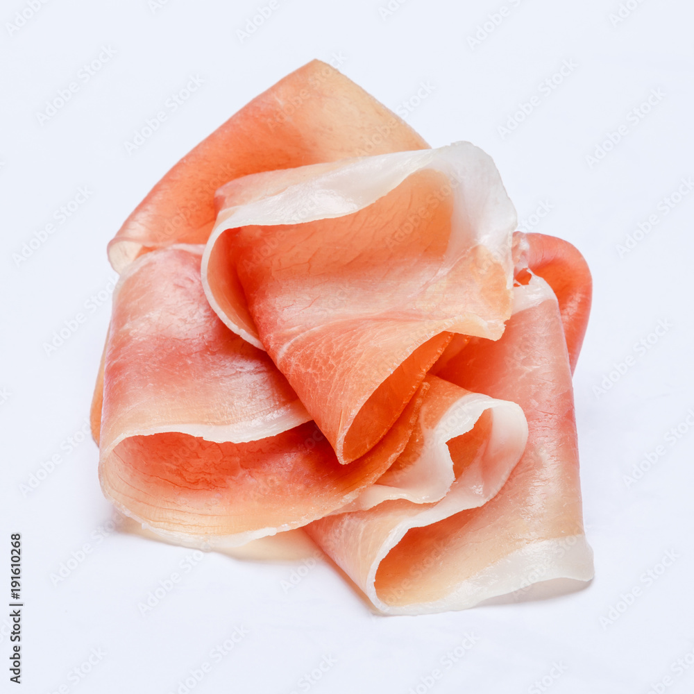 Italian prosciutto crudo or spanish jamon. Raw ham on white background.