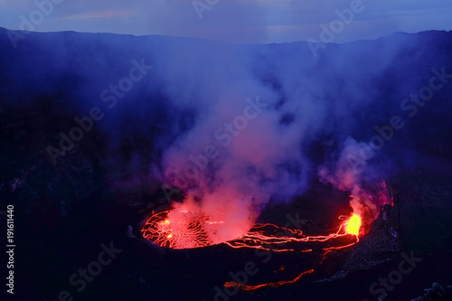 Lava and steam in crater of Nyiragongo volcano in Virunga National Park in Democratic Republic of Congo, Africa