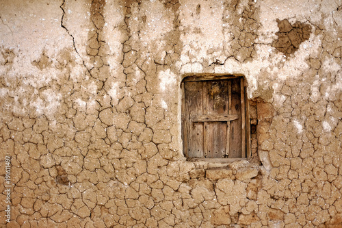Clay house with wooden window in Africa hit by drought