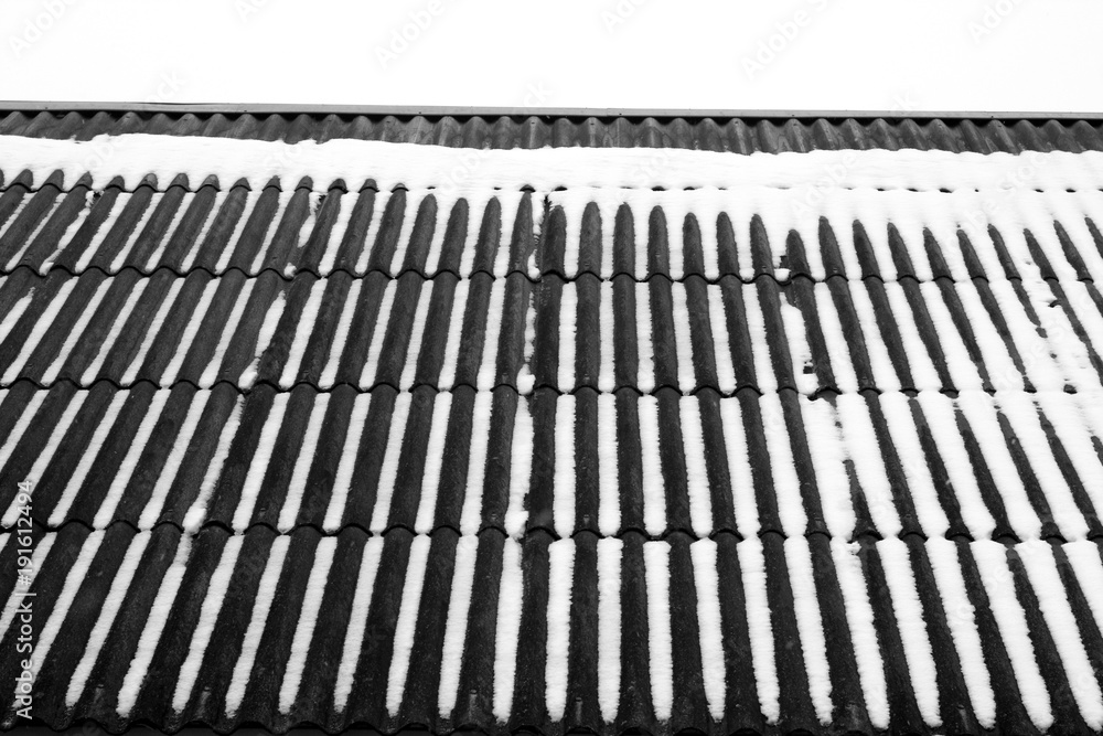 Snow on the house roof in black and white. Snow on the house roof in black and white.