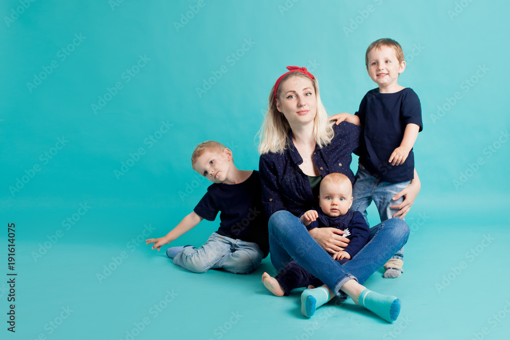 Mom and sons, portrait on blue background