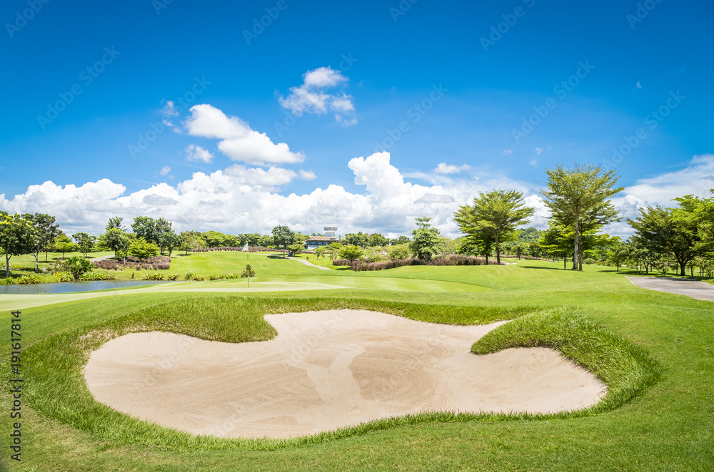 The sand Bungker in golf course with blue cloud sky background 