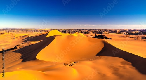 Sunset view to Tin Merzouga dune at Tassili nAjjer national park in Algeria photo