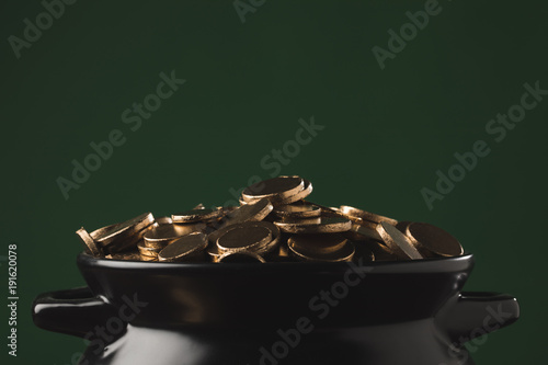 shining golden coins in pot, st patricks day concept