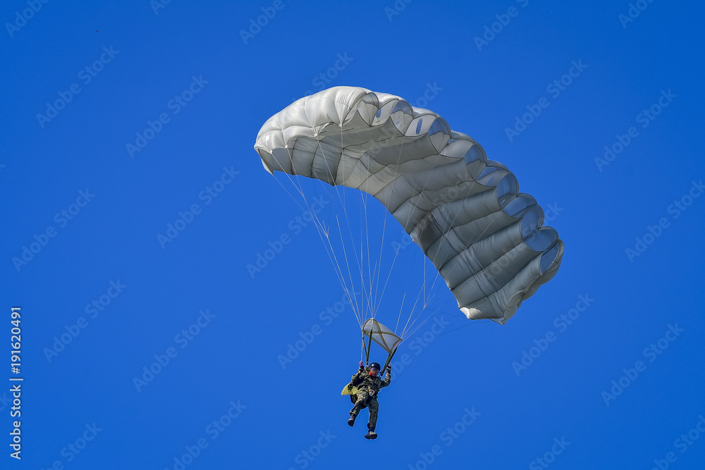 Skydriver jumping with parachut with blue cloud sky background Skydriver jumping with parachut with blue cloud sky background