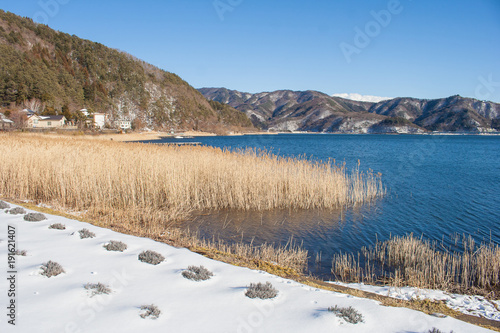 Beautiful landscape view of Kawaguchiko Lake with white snow in winter seasonal at Yamanashi, Japan.