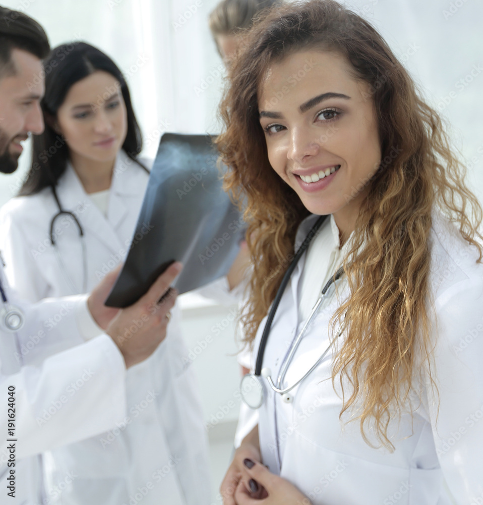 confident doctors in hospital looking at x-ray. confident doctors in hospital looking at x-ray.