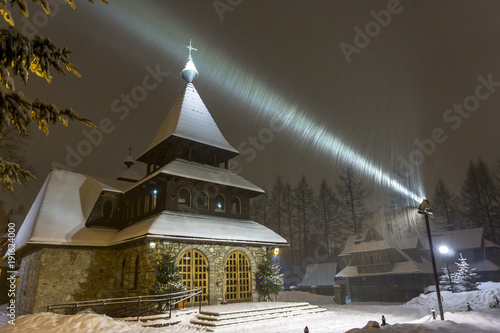 A beautiful church by night in a winter scenery. Bystre. Zakopane. photo