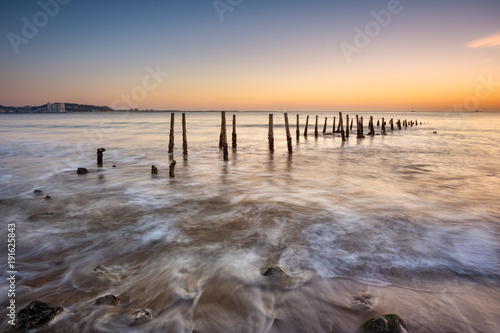 Anciente pier near Lisbon regarding sunset photo