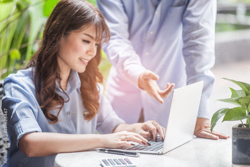 Business team meeting present, Manager and secretary working with new startup project with laptop,calculator and smart phone on desk. Business team meeting present, Manager and secretary working with new startup project with laptop,calculator and smart phone on desk.