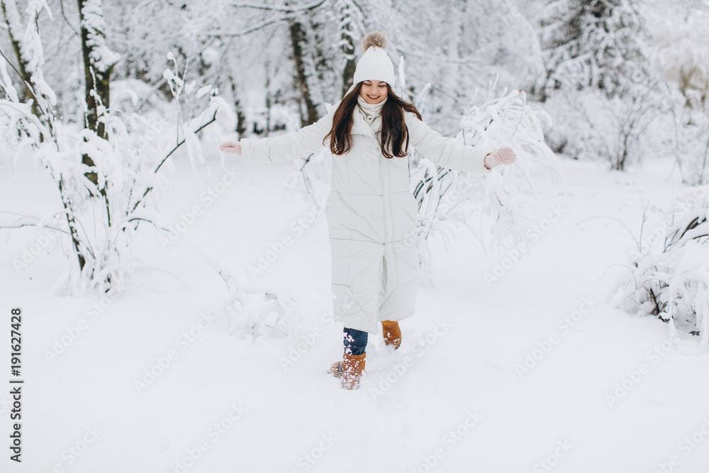 custom made wallpaper toronto digitalA beautiful and fashoin woman in white warm clothing walking in snowy weather.