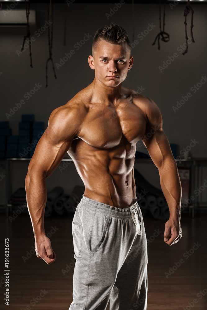 Bodybuilder posing on GYM Bodybuilder posing on GYM