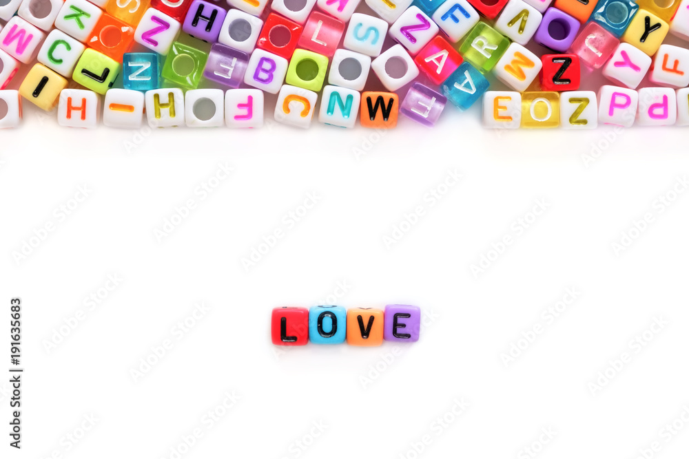 LOVE word and alphabet letter beads on white background for Valentine's day and love concept LOVE word and alphabet letter beads on white background for Valentine's day and love concept