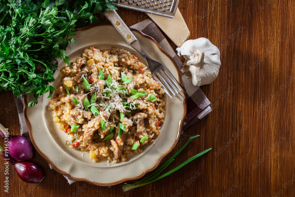 Risotto with champignon mushrooms, pork and parmesan Risotto with champignon mushrooms, pork and parmesan