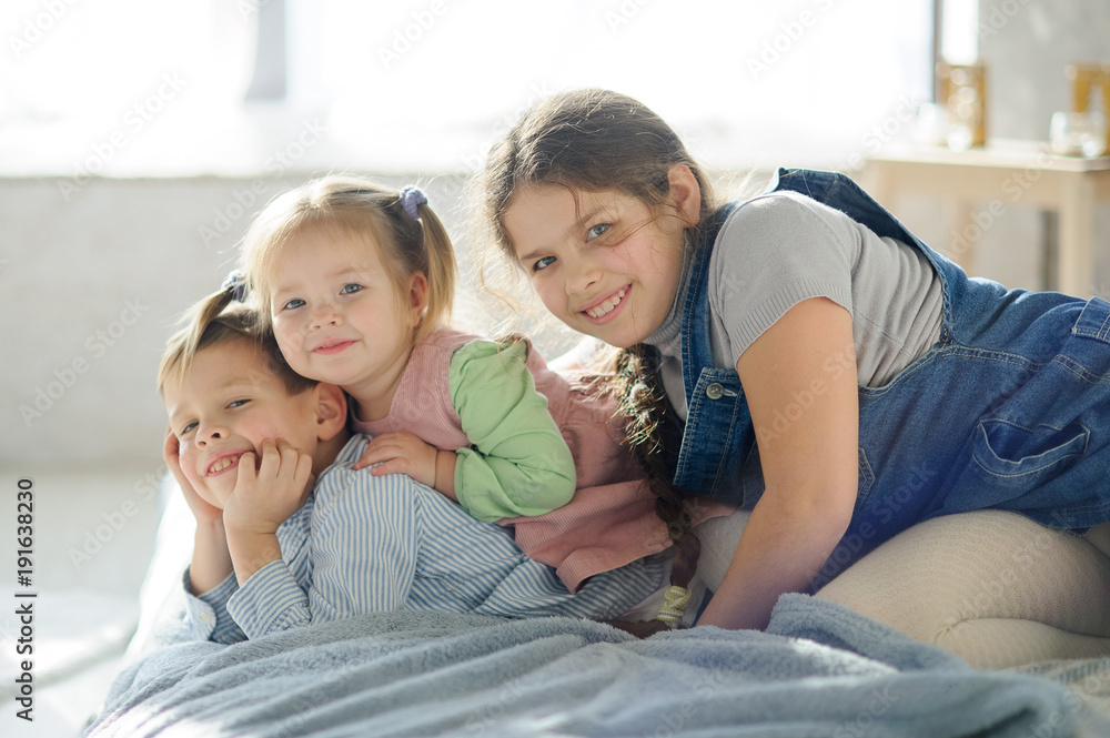 Fototapeta premium Two sisters and a brother.