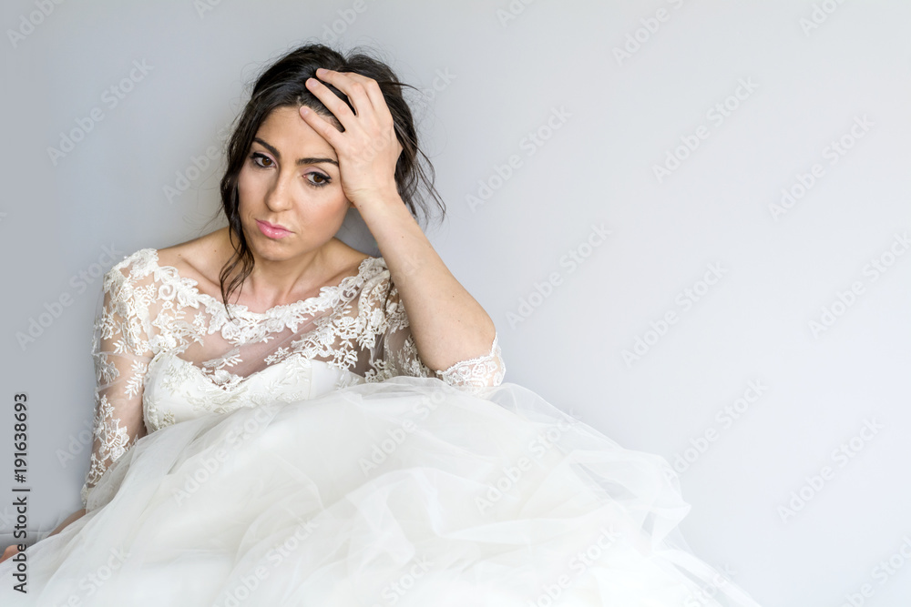Sad and Worried Bride in her Wedding Day Sad and Worried Bride in her Wedding Day