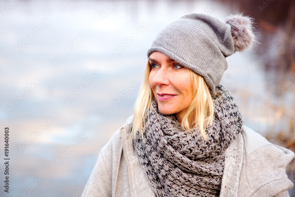 beautiful blond woman in front of lake beautiful blond woman in front of lake