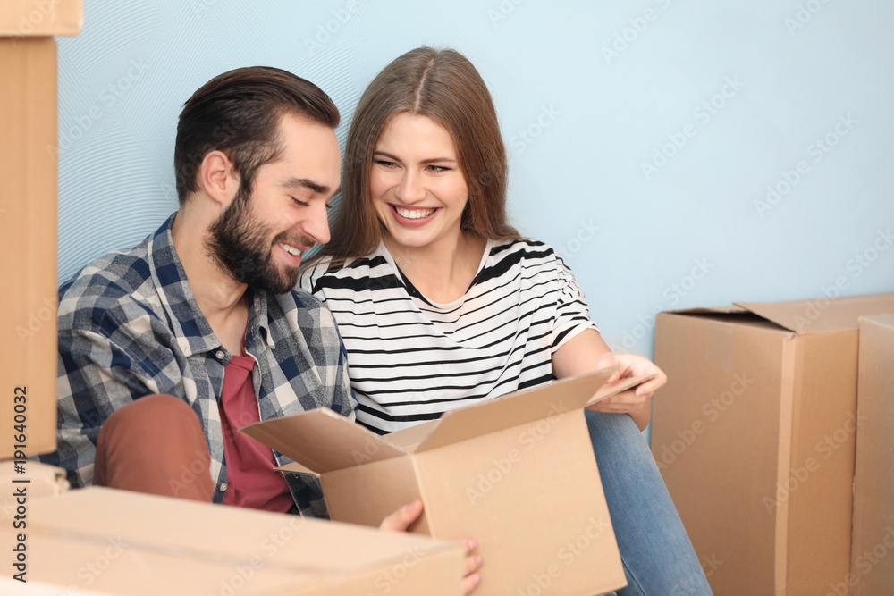 Young couple in their new house. Moving day Young couple in their new house. Moving day