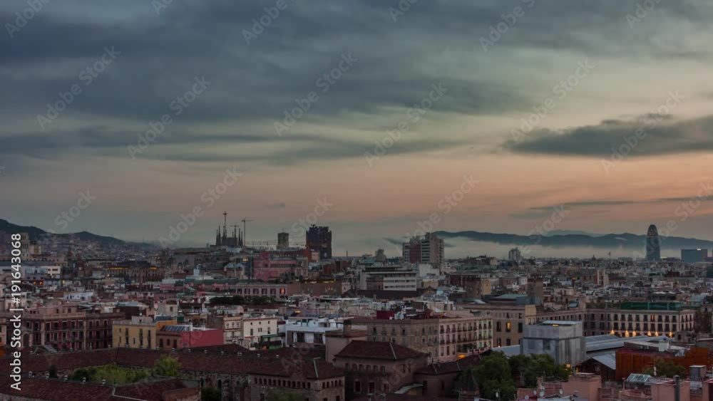 BARCELONA, CATALONIA - JULY 26th 2017: Timelapse of city centre from above rooftop architecture BARCELONA, CATALONIA - JULY 26th 2017: Timelapse of city centre from above rooftop architecture