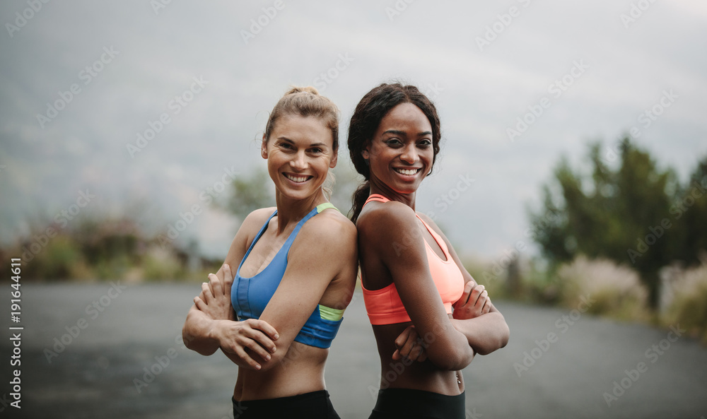 Women in fitness attire on road early in the morning. Fitness wo Women in fitness attire on road early in the morning. Fitness wo