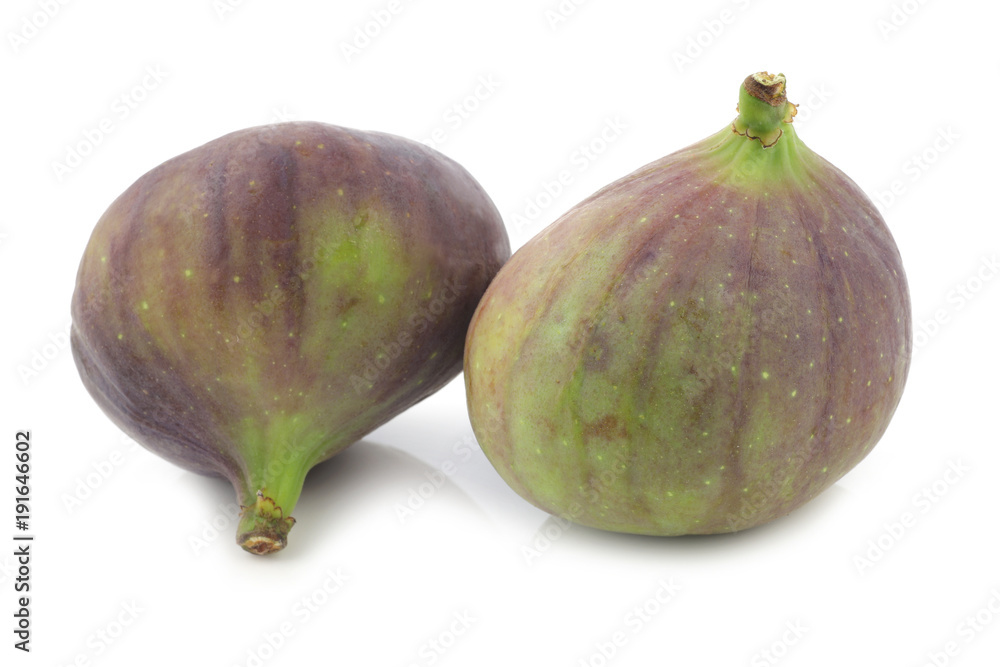 two figs (Ficus carica) on a white background